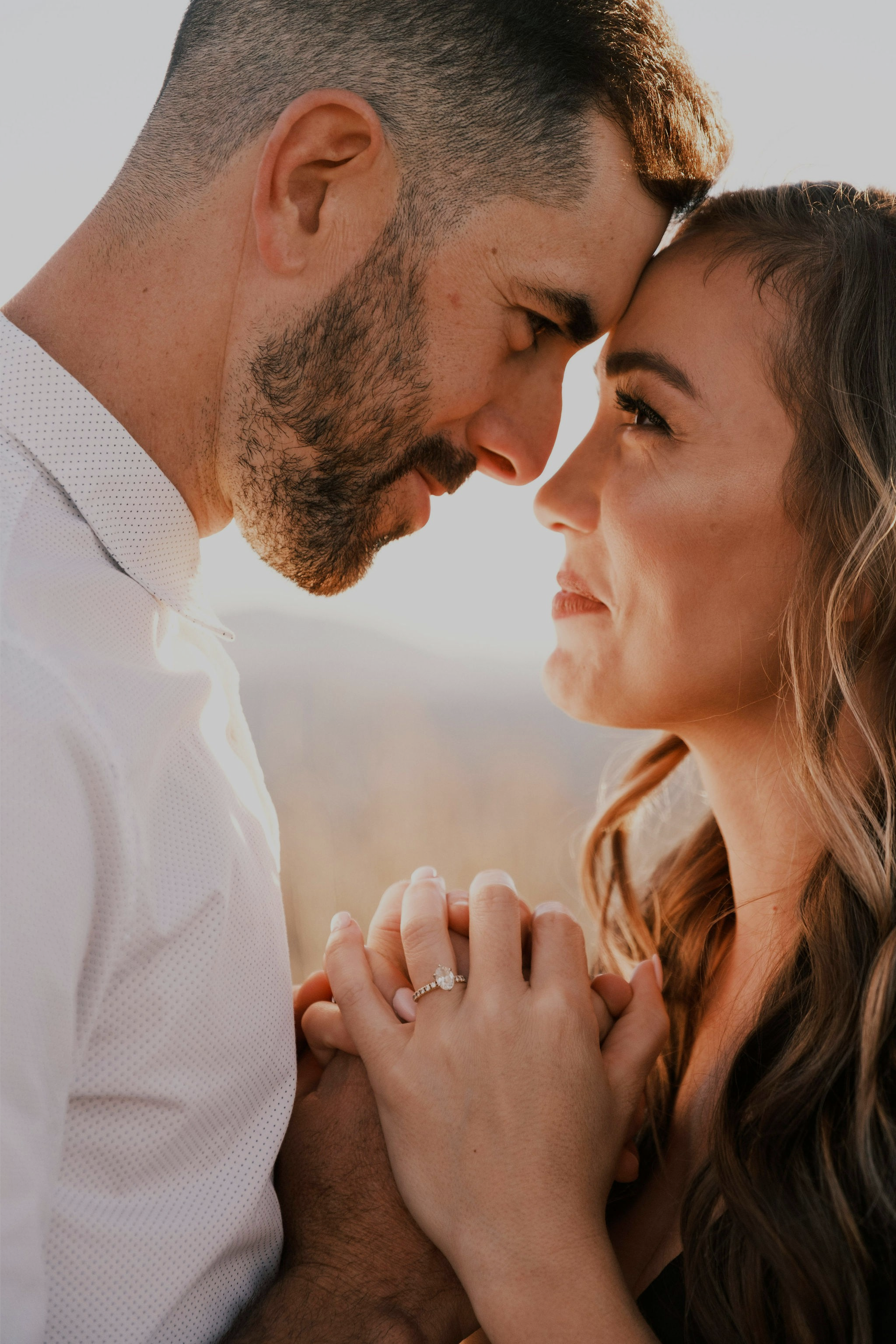 Christian couple loving on one another as they gaze into each others eyes happy after dealing with conflict in their marriage