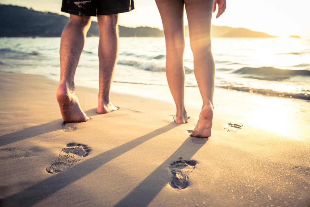 people walkiing on beach