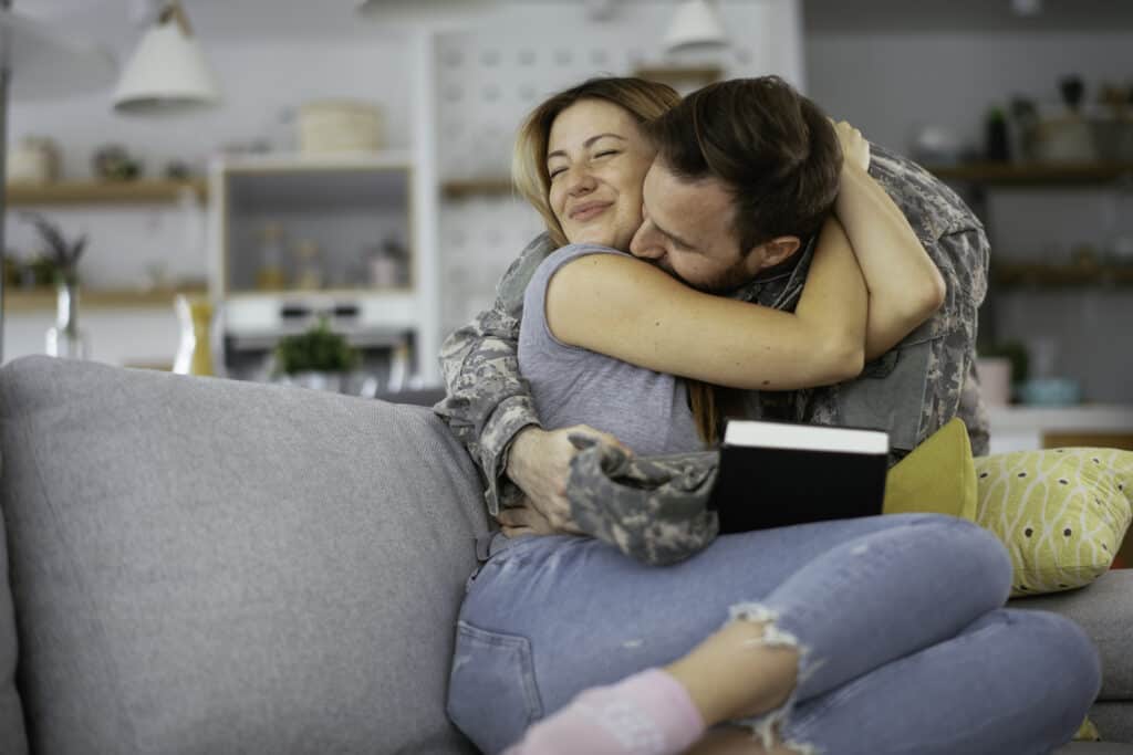 couple hugging on couch