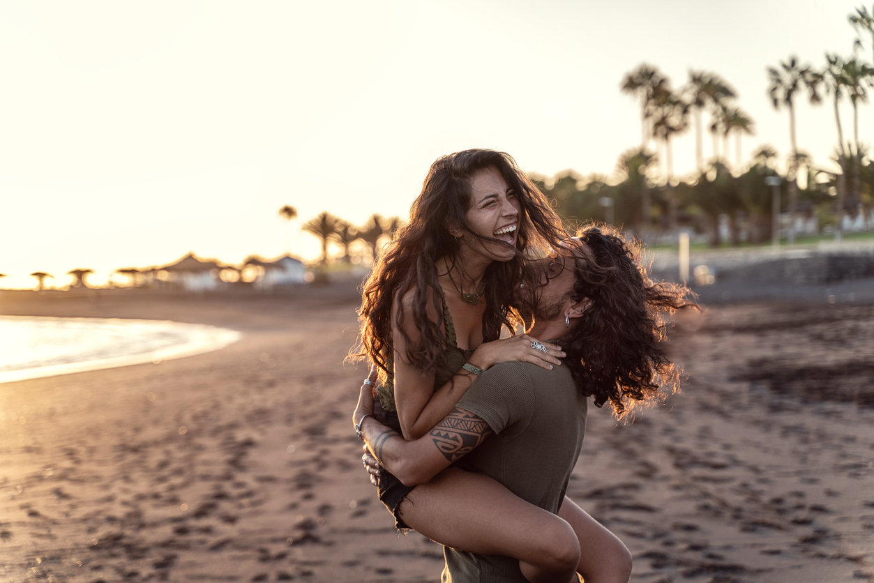 couple hugging man holding woman