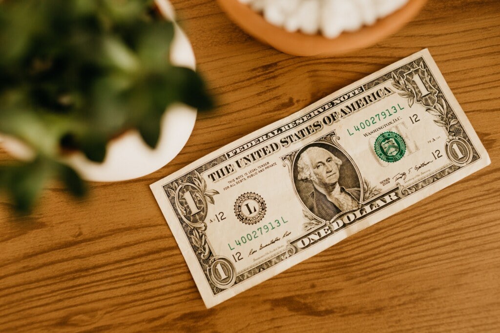 a 1 dollar bill on on a table