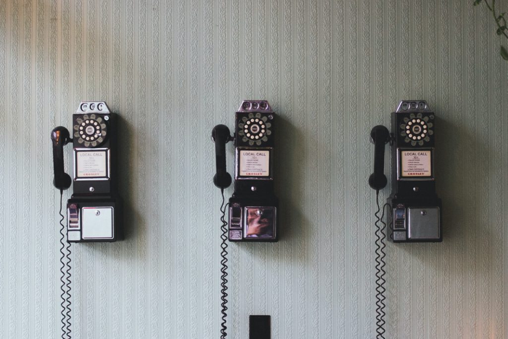 old phones on a wall