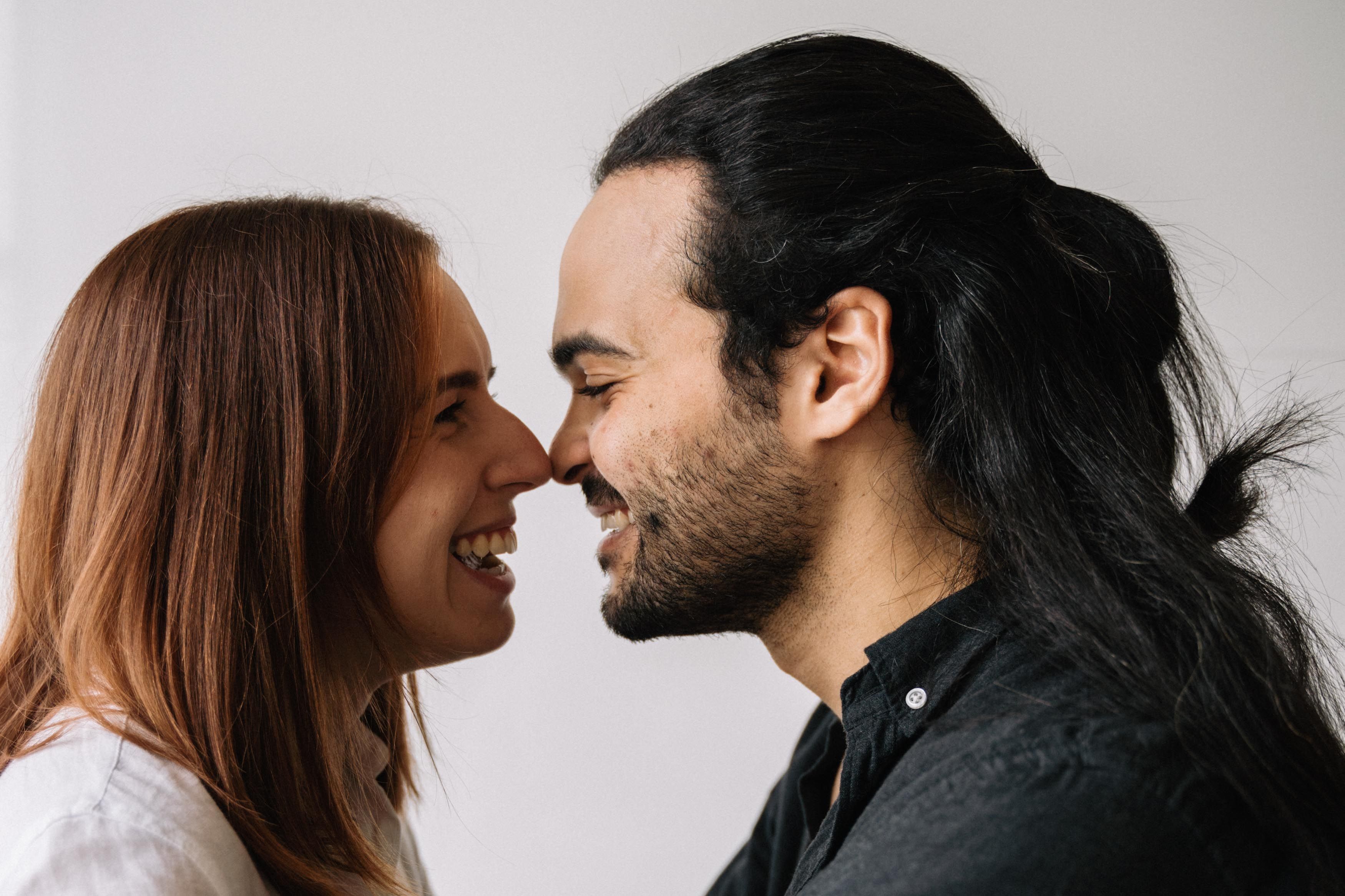 Couple smiling and looking at each other for XO Marriage website
