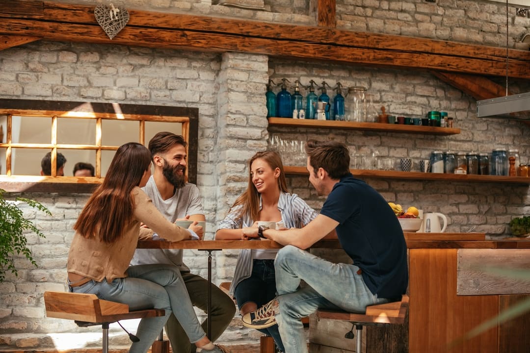 friends sitting around a table