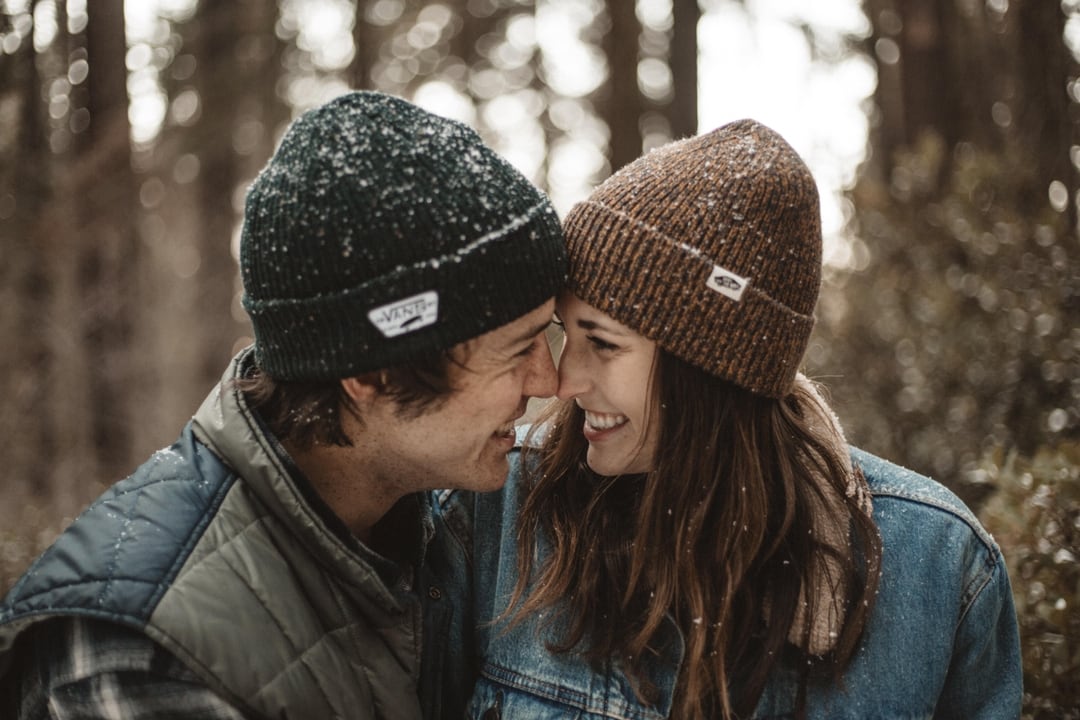 couple looking at each other with their heads together