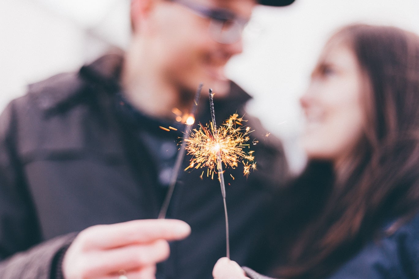 couple holding sparklers