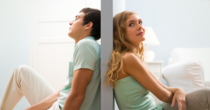 couple seperated by a wall