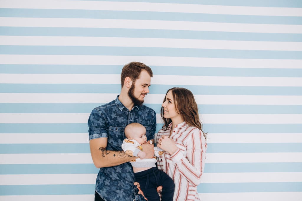 couple holding baby